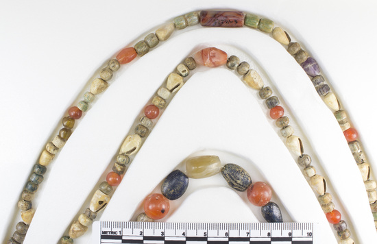 Hearst Museum object 4 of 10 titled Beads, accession number 6-16293, described as Beads: string of shell, carnelian, green stone amethyst, various shapes, l  62 cm. open.