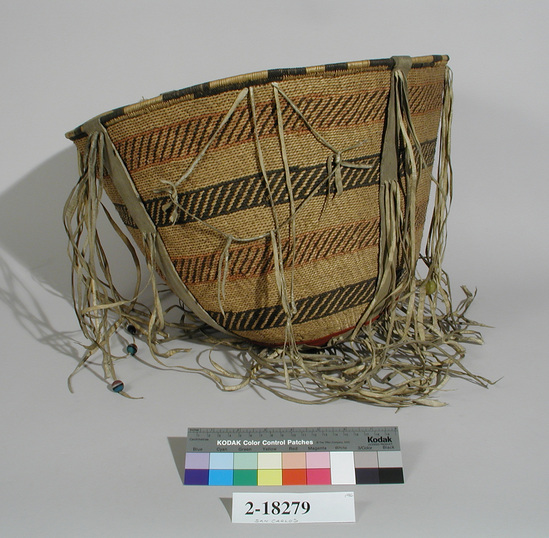 Hearst Museum object titled Burden basket, accession number 2-18279, described as Twined, buckskin fringe, big heads.