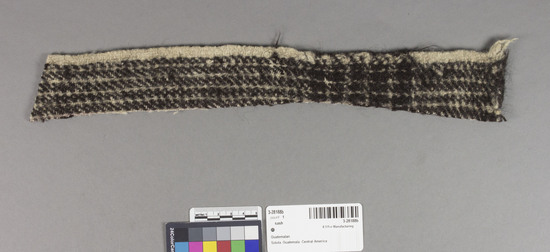 Hearst Museum object titled Swatch, accession number 3-28188b, described as Plain weave wool swatch with nap raised.  Black and white checked. 2X 14.5 inches irregular shape.