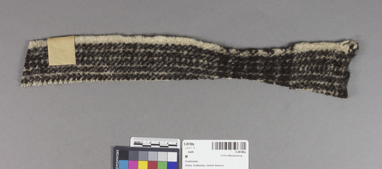 Hearst Museum object titled Swatch, accession number 3-28188a, described as Plain weave wool swatch with nap raised.  Black and white checked. 2 X 15 inches irregular shape.