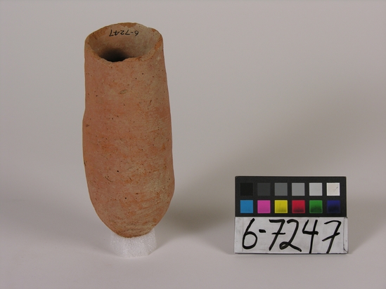 Hearst Museum object 1 of 10 titled Beer cup, accession number 6-7247, described as Pottery, deep red cup, pointed bottom, rim chipped: least diameter 5 cm, greatest 6.5 cm, height 16 cm