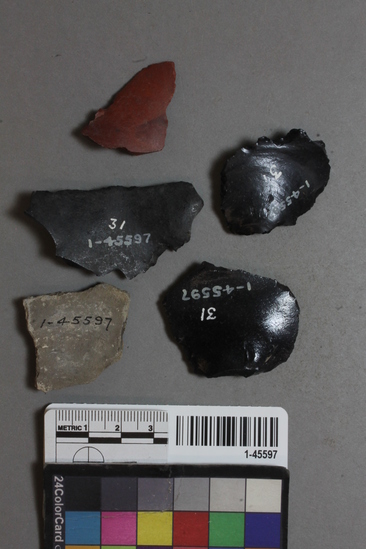 Hearst Museum object titled Flakes and potsherd, accession number 1-45597, described as 3 made of obsidian, 1 made of red flint.