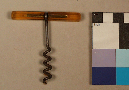 Hearst Museum object titled Corkscrew, accession number 2-68692, described as Corkscrew, tee handle; yellow plastic handle; steel wire shank wrapped around handle; wire helical worm, 6.9 cm long. Cork puller.