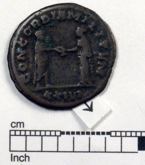 Hearst Museum object 6 of 8 titled Coin: billon antoninianus, accession number 8-4075, described as Coin; Billon; Antoninianus; Roman. 2.81 grams, 22 mm. Aurelian, 270-275 AD. Mediolanum, Italy. Obverse: IMP C AVRELIANVS AVG, Bust r. radiate. Reverse: RESTITVT ORIENTIS, female standing r. presents wreath to emperor in armor, in exergue P